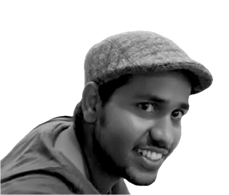 Portrait of Prakash Upadhyay in a flat cap, smiling, turned to the right